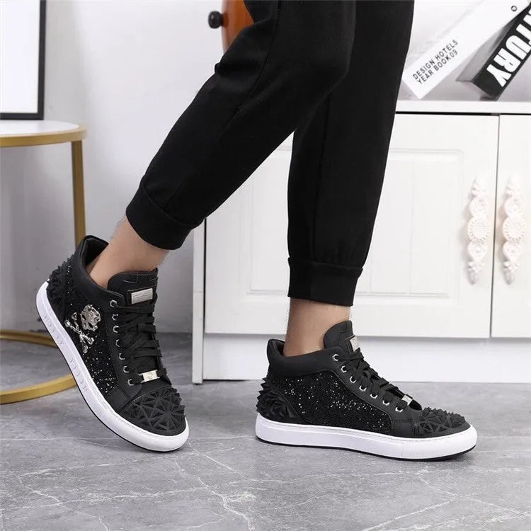 Men's black high top shoes with a skeleton design detail on the leather upper.