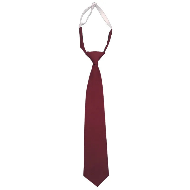 Men's solid navy blue cotton tie on a white background, showing its arrow shape and dimensions.