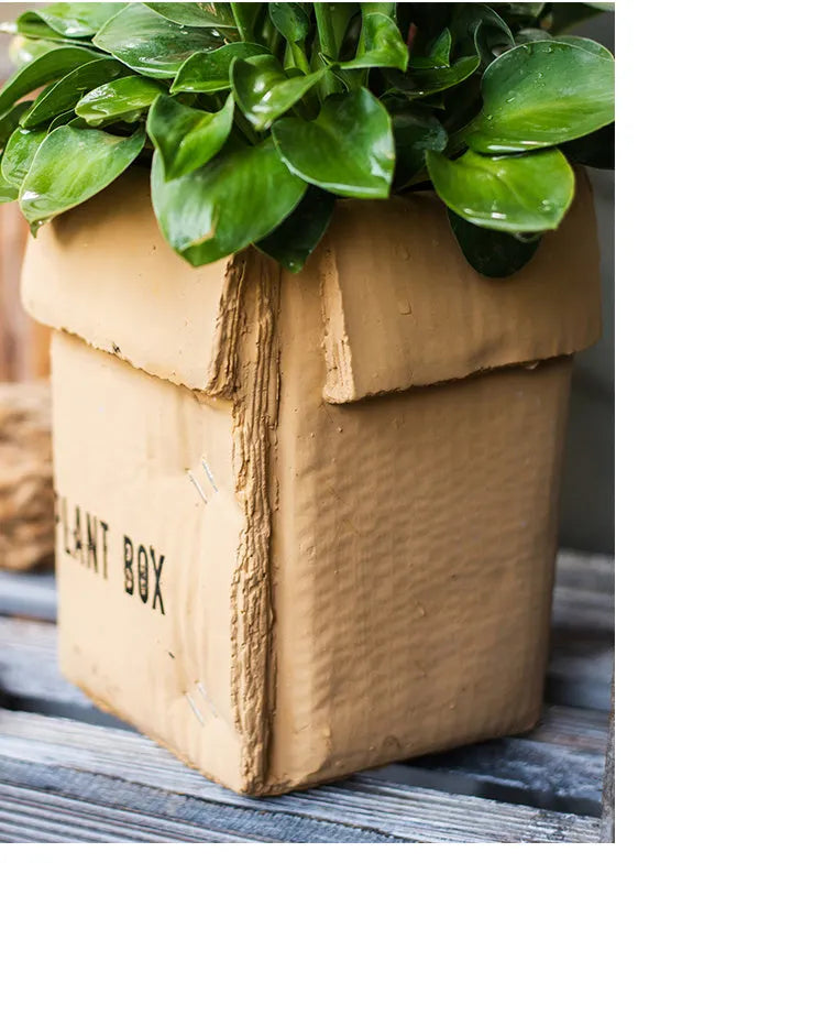 Cement flowerpot with paper carton aesthetic and drainage hole in Nordic style for indoor plants