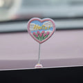Six yellow PVC duckling car decorations with Hello sign on car dashboard