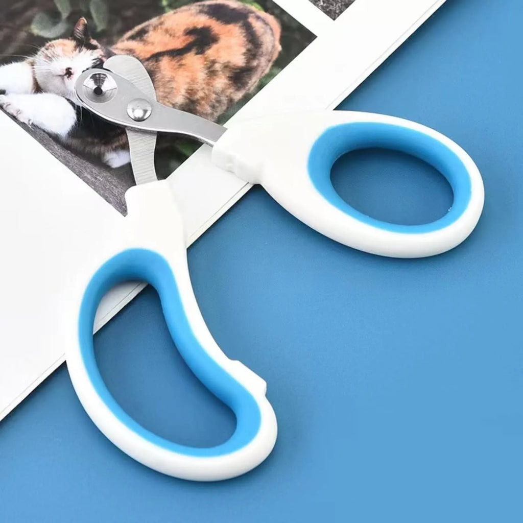 Blue cat nail clippers with circular cutting hole and cushioned non-slip handles on a white background.