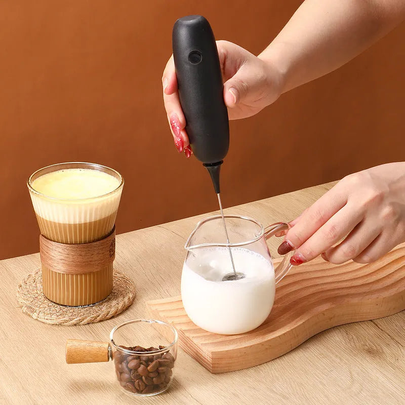Black and white handheld electric milk frother blender with modern design
