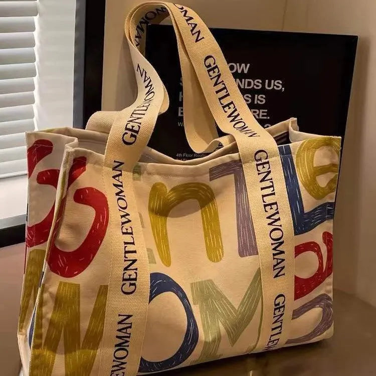 Large canvas women's tote bag with printing, shown in different colour and pattern style options.