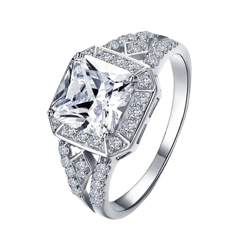 Women's geometric zircon ring with hollow design and quadrilateral shape in platinum colour.