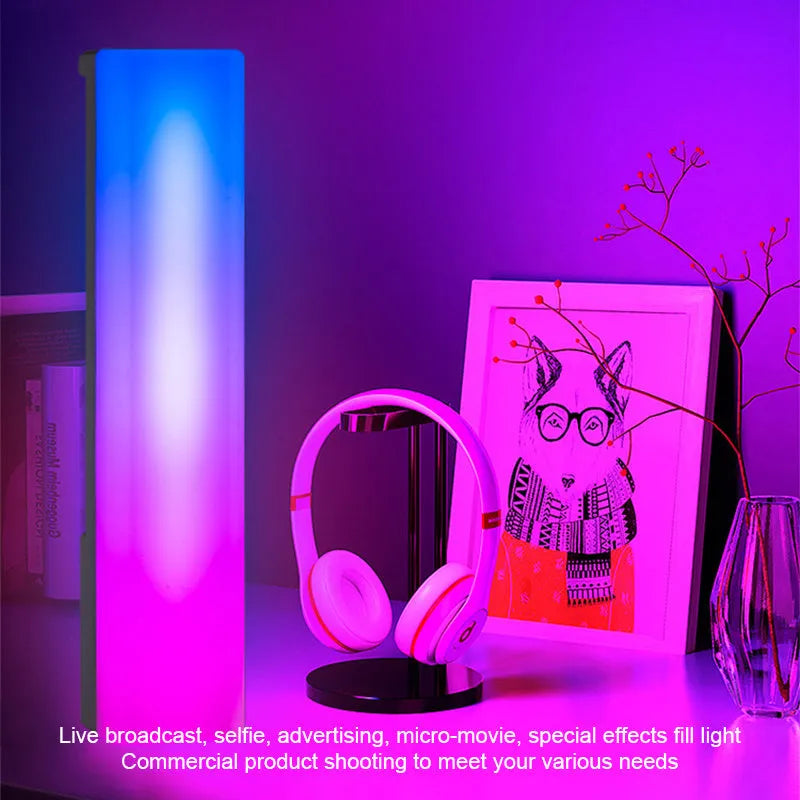 Black and white 3D RGB music rhythm ambiance lamp on a table with USB cable.