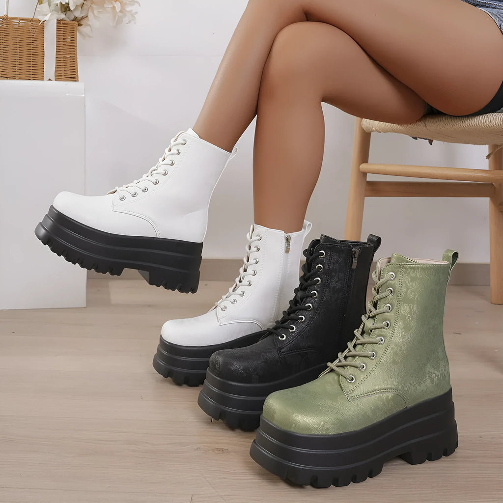 Women's white retro platform martin boots with patchwork detail and a side zip.