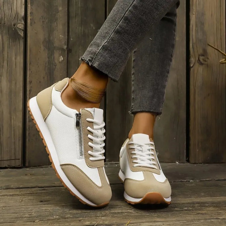 Women's flat-heeled shoes in champagne, grey, and white colours with synthetic PU upper and rubber sole