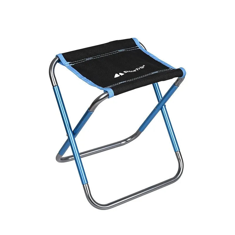 Black ethnic style folding camp stool with 7075 aluminium alloy frame in folded position.