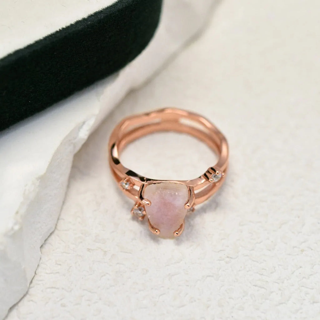S925 sterling silver ring with irregular triangle design holding a moonstone, shown in rose gold plating.