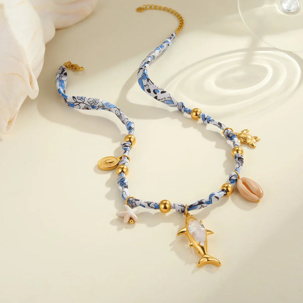 Gold starfish shell pendant on hand-knotted rope chain, 18K plated stainless steel, geometric shape