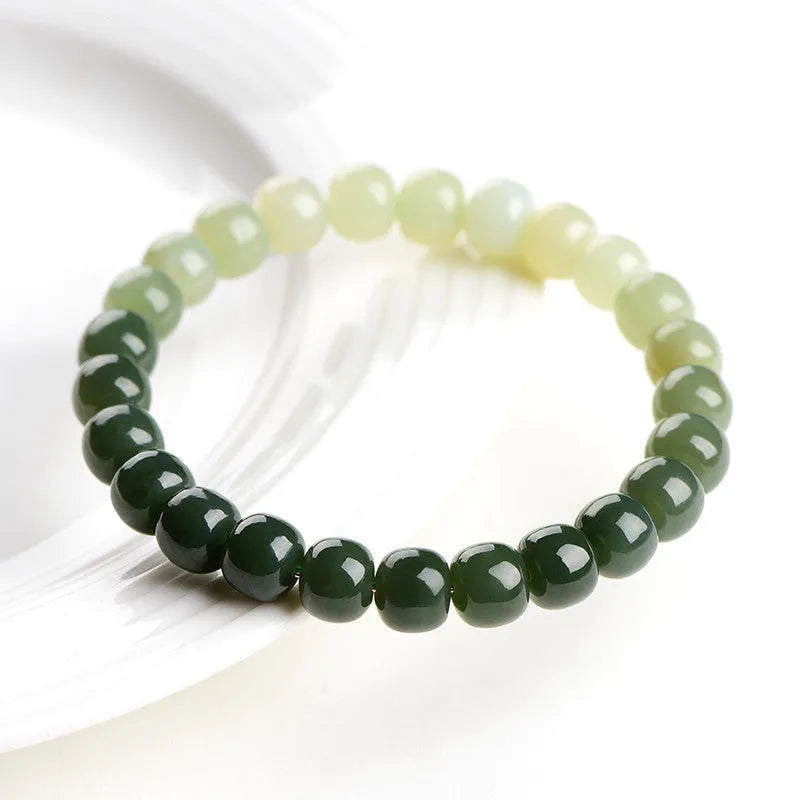 Natural Hetian Jade bracelet with water gradient colour and polished beads in unisex casual style.
