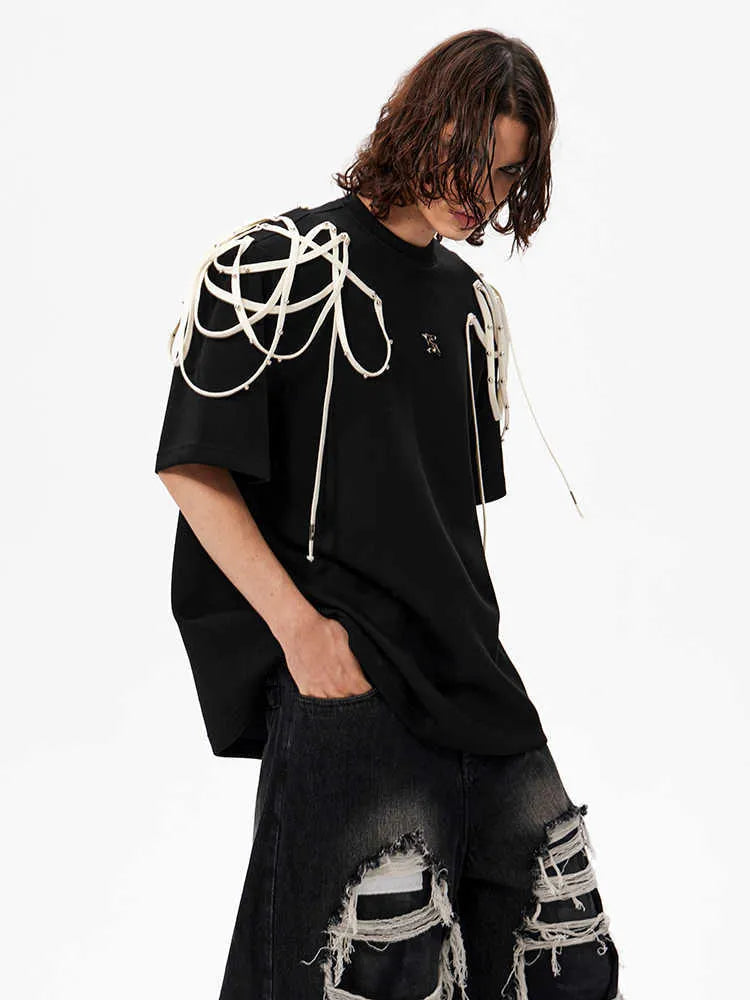 Black loose fit T-shirt with padded shoulders and short sleeves on hanger