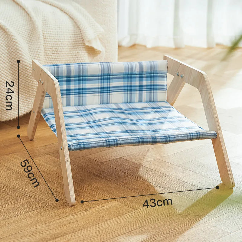 Wooden elevated cat bed with blue cloth hammock in beach chair design for indoor cats