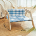 Wooden elevated cat bed with blue cloth hammock in beach chair design for indoor cats