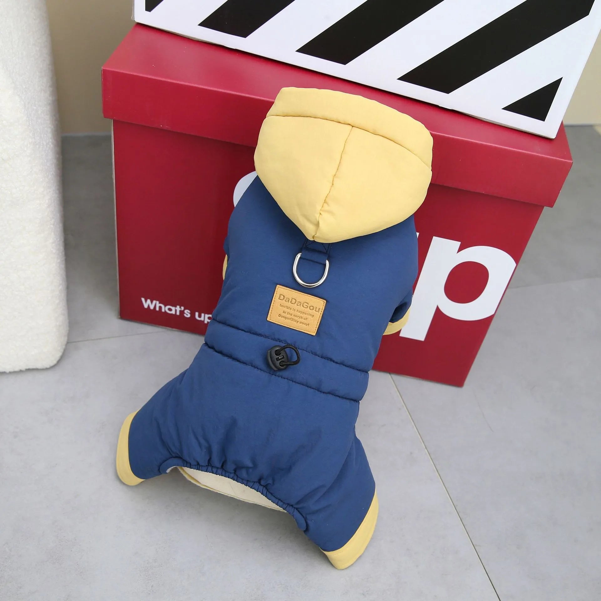 Dog wearing autumn winter four-leg cotton-padded coat in dark navy blue