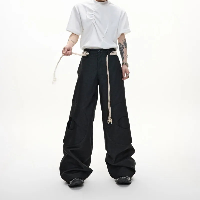 Men's dark blue straight-leg cotton jeans showing 3D cutting, belt stitching, and zipper pocket details.