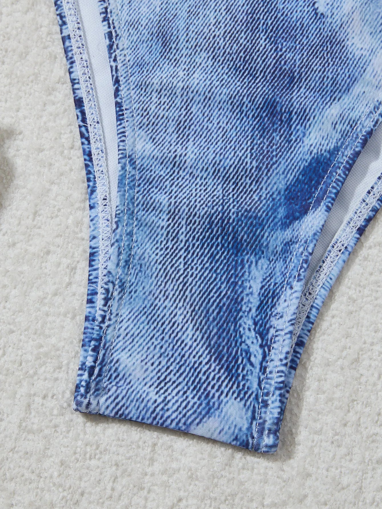 Women's denim blue printed strappy bikini set showing front view of two-piece swimwear