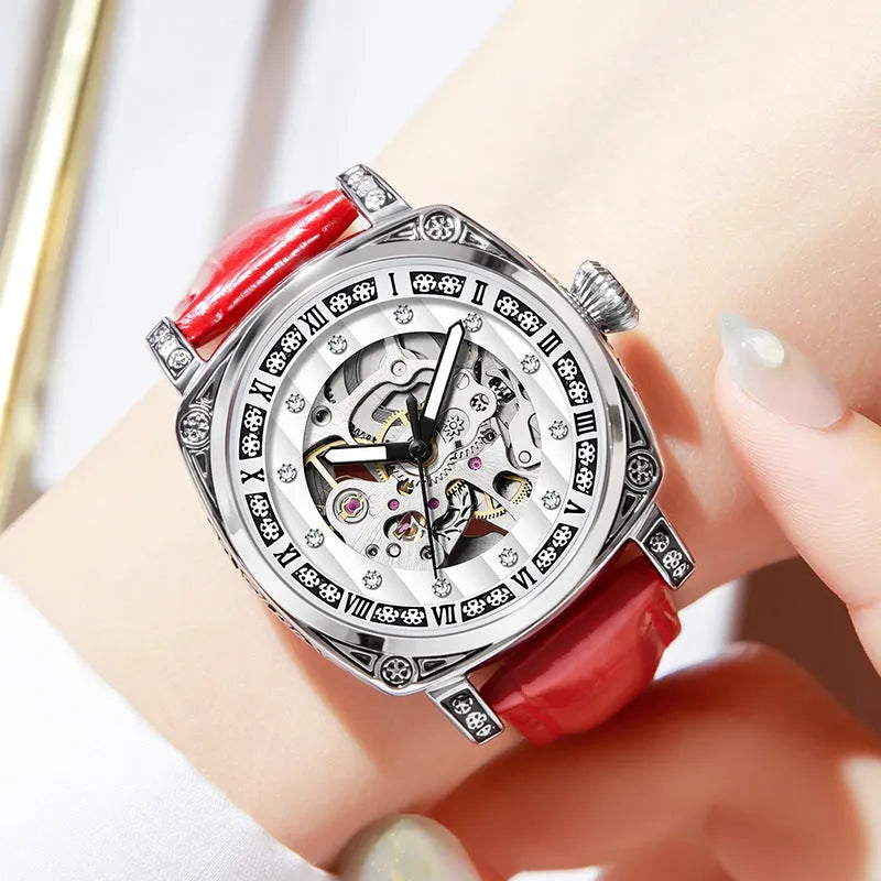 Men's black mechanical watch with luminous hands on a leather belt strap with needle detailing.