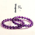 Natural amethyst bracelet with scattered Uruguay beads in jiuya colour, shown in selectable grades and sizes.