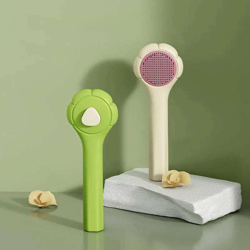 Floating needle comb for cats and dogs in green colour with ABS handle and steel teeth