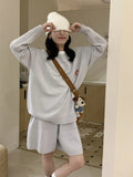 Women's knitted sweater and shorts suit in imitation cashmere fabric with embroidery detail