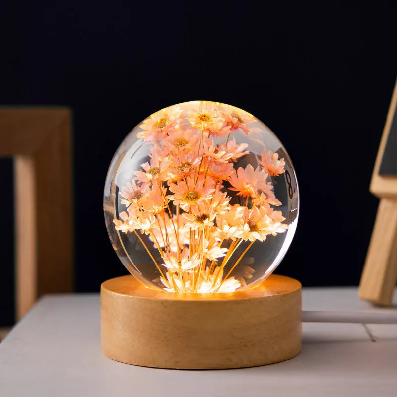 Dandelion crystal ball night light with wooden base, showing preserved flowers inside a 6cm resin sphere.