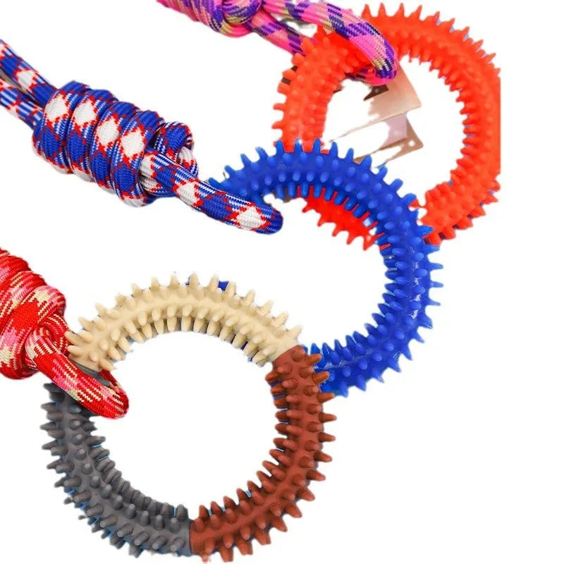 Blue braided rope dog toy with knots for tugging and chewing by a medium-sized dog