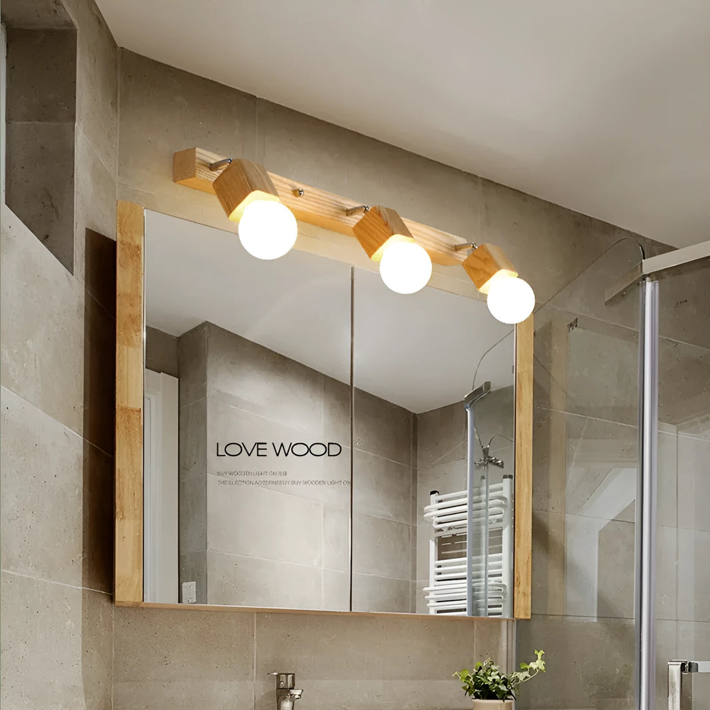 Single-head mirrored cabinet LED wall lamp with a 24cm size on a white wall.