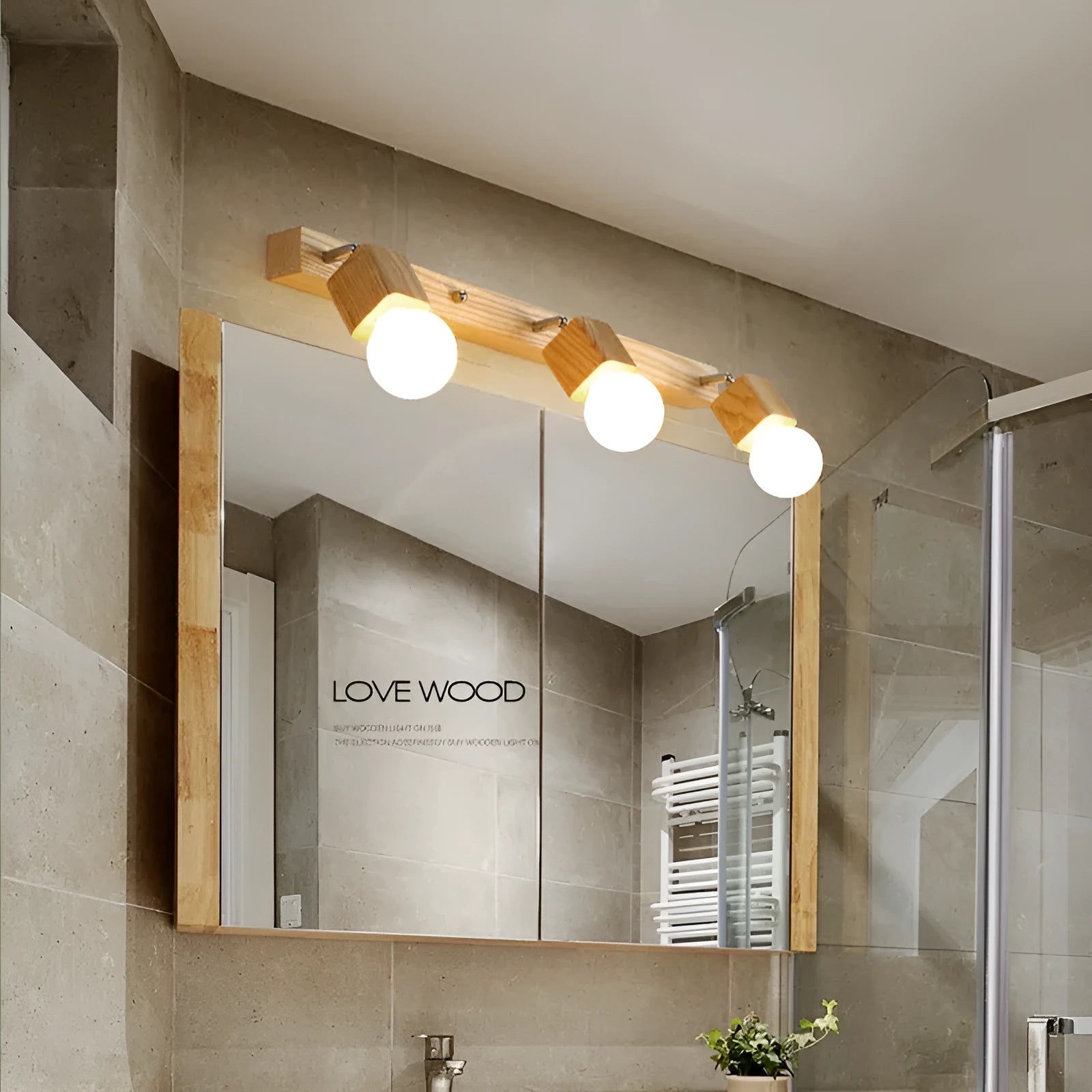 Single-head mirrored cabinet LED wall lamp with a 24cm size on a white wall.