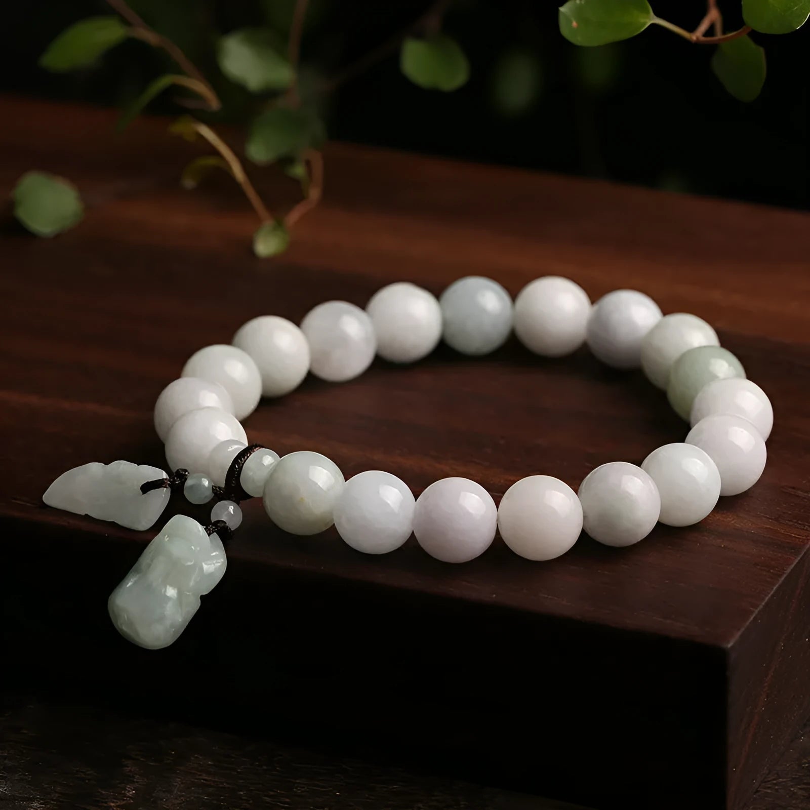 Jade hanging bracelet with Maitreya Buddha, apple, gourd, and money bag charms