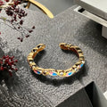 Women's adjustable copper ring with gourd design, flower and bow motifs, and inlaid zircon stones in a vintage oil dripping finish.