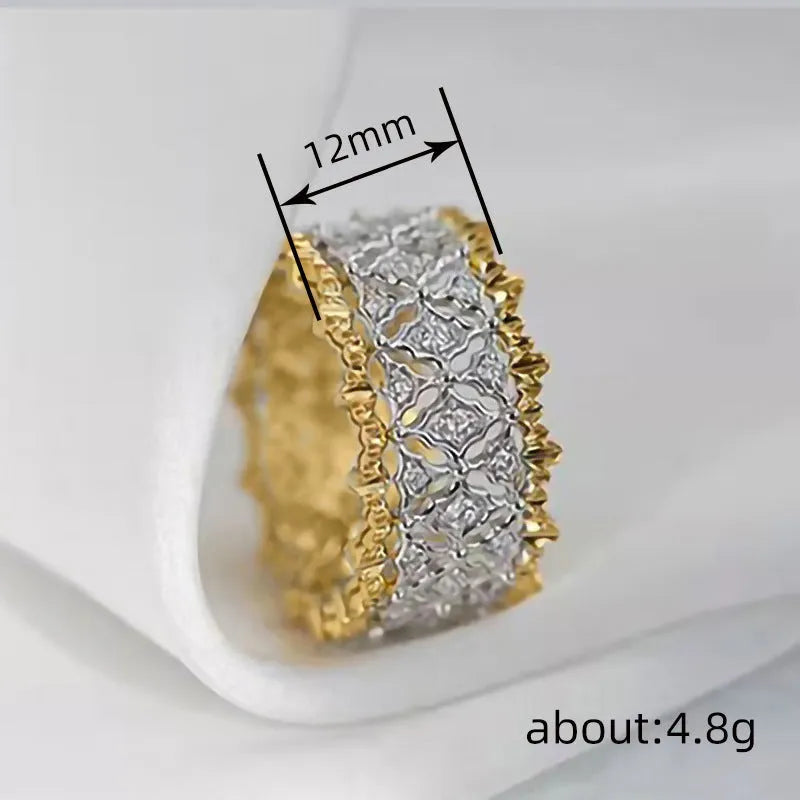 Geometric two-tone gold ring with a round zircon centre on a copper band.