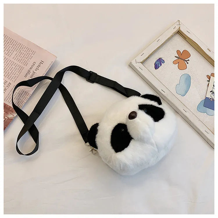Soft plush cylindrical panda head crossbody bag showing front sandwich pocket.
