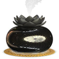 Pure black round Lotus ultrasonic aromatherapy humidifier with USB cable.