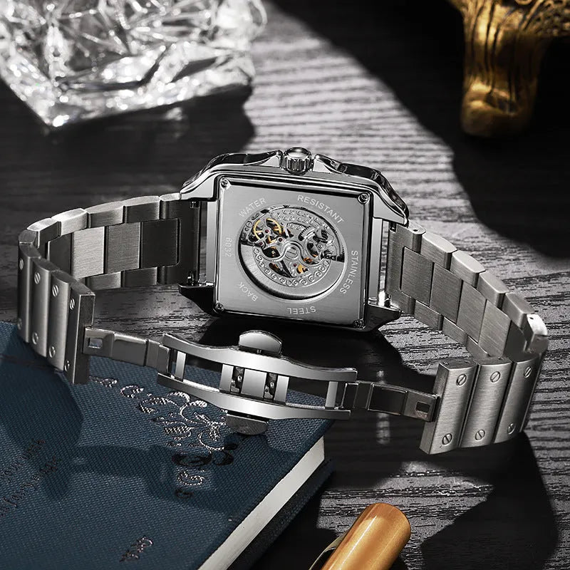 Men's square automatic watch with diamond-studded dial on a black leather strap.