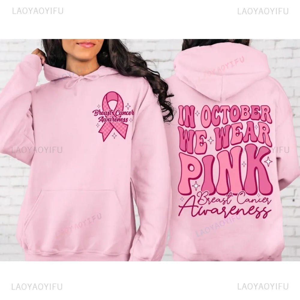 Women's pink breast cancer awareness pullover hoodie with a retro graphic design and side seam pockets.