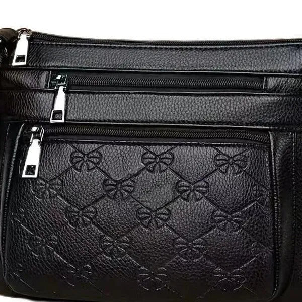 Butterfly Black horizontal square PU crossbody bag for women with external slit pocket and embossed detail