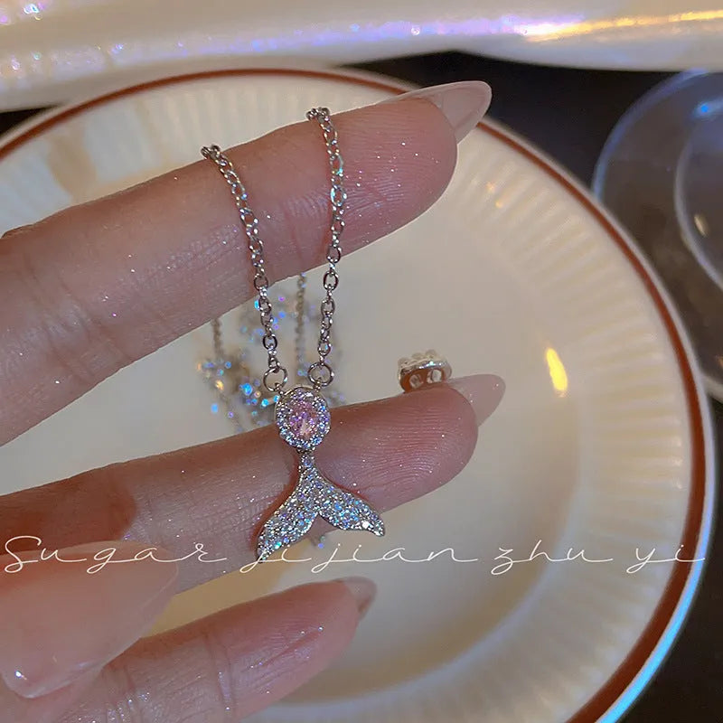 Women's sterling silver fishtail pendant necklace on an adjustable O-ring chain.
