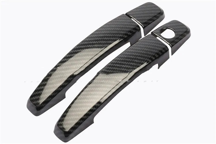 Carbon fibre pattern door handle cover for Opel Vauxhall Astra H and J car interior.