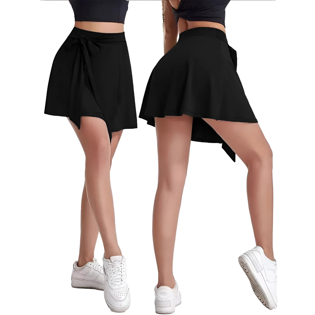 Black thigh-length sports culottes with built-in safety shorts and shoulder strap detailing