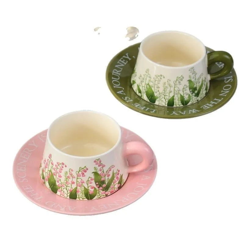 Ceramic coffee cup and saucer set for two people in Campanula design, with two mugs, two saucers, and two spoons.