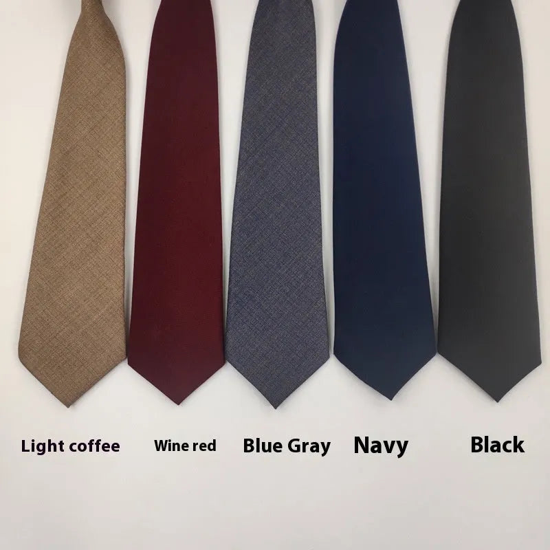 Men's solid navy blue cotton tie on a white background, showing its arrow shape and dimensions.