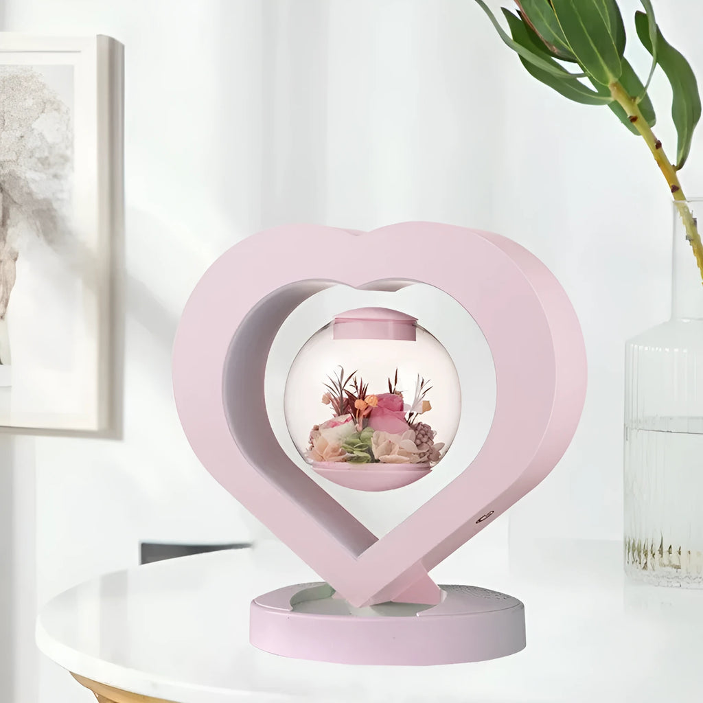 Pink preserved real rose ornament in a decorative case with optional base and Bluetooth speaker.