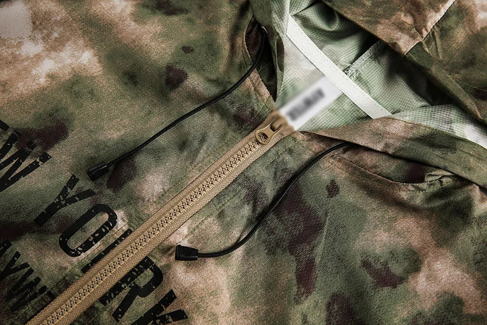 Hooded camouflage sun protection jacket for men, loose fit polyester fibre, shown in camouflage colour.
