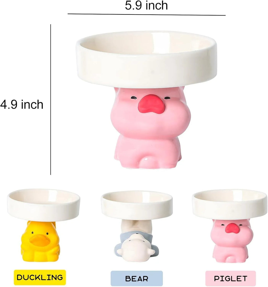 Ceramic elevated cat food bowl with animal theme design in pink, yellow, or white