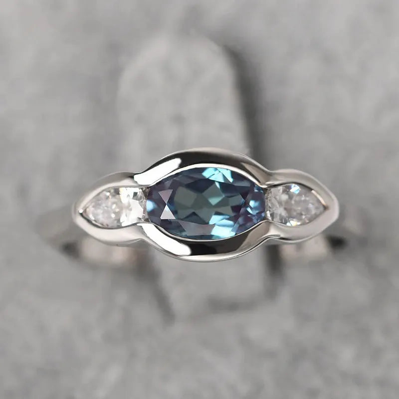 Geometric ellipse women's ring with zircon inlay in white gold colour plating