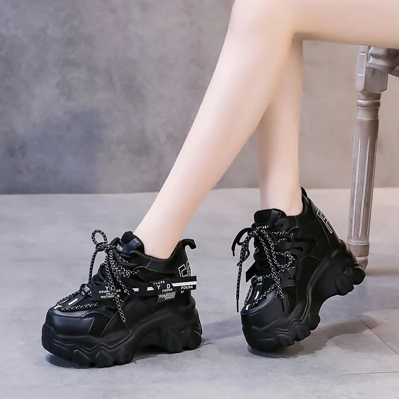 Women's white mesh platform sports shoes with cross strap and round toe on rubber sole.