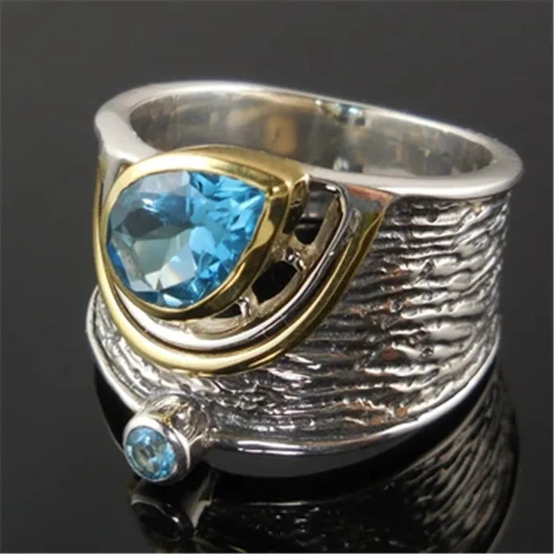 Blue Chinese style drop shape ring with rhinestone zircon inlay on alloy band showing women's jewellery