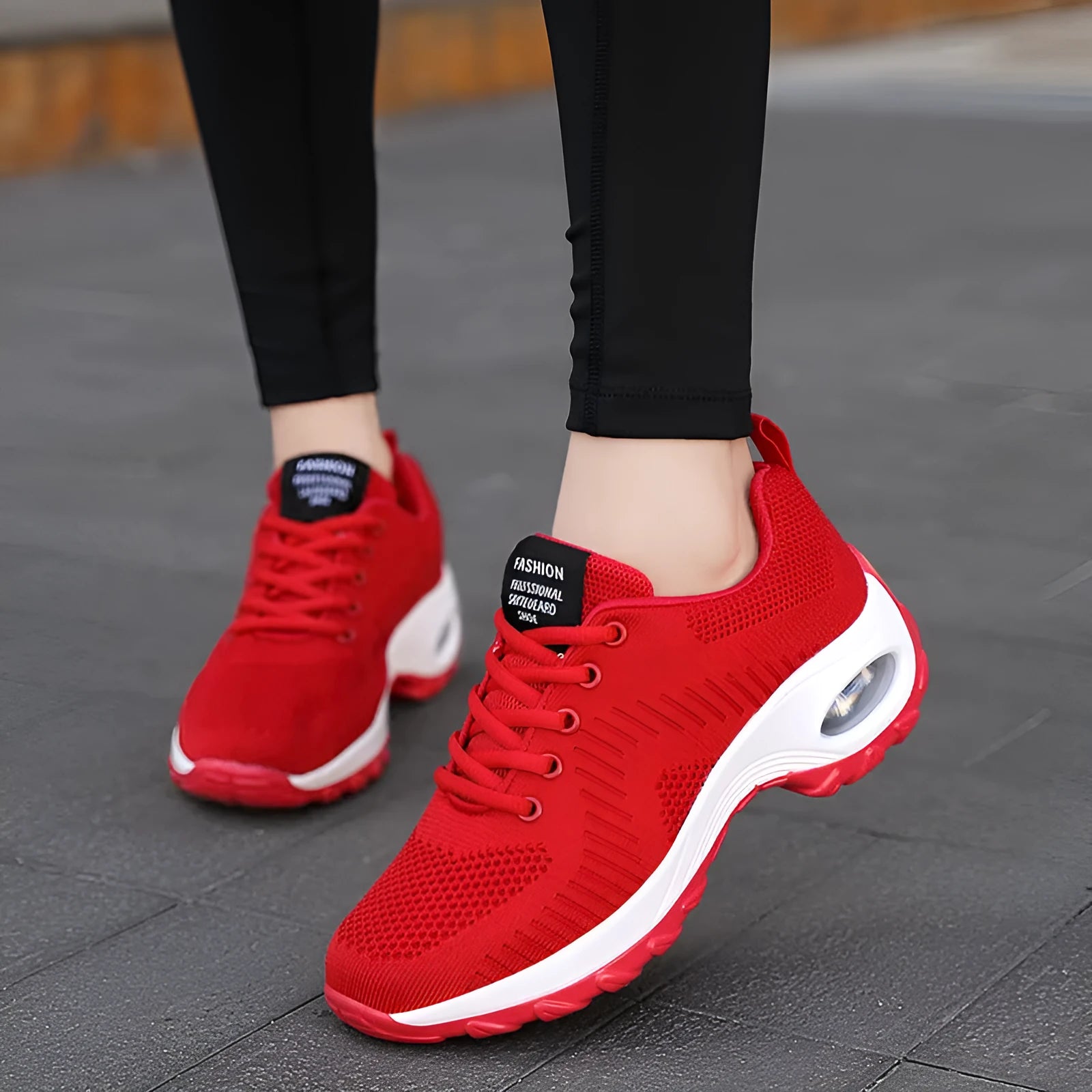 Women's red mesh sneakers with round toe and front lace-up design showing 3-5cm heel height