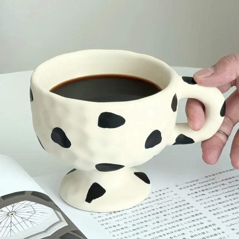 Hand-pinched irregular ceramic mug in solid colour with modern design and 14.5cm height